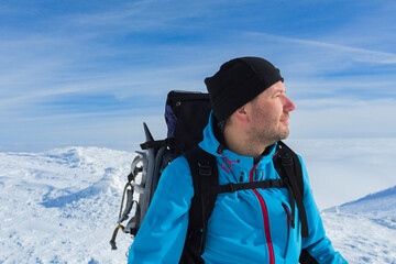 Man portrait in winter hike sunny day