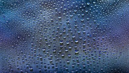 Drops of water. Abstract gradient background. Drop texture. Dark blue gradient. Heavily textured image. Shallow depth of field. Selective focus