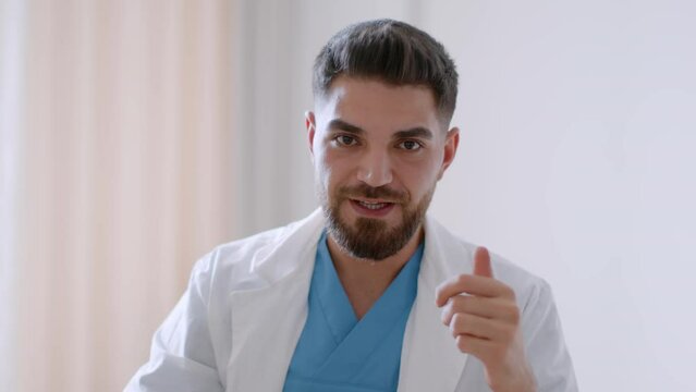 Medical cure. Patient pov of middle eastern doctor talking and giving pill for treatment during consultation in clinic