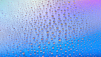 Naklejka na ściany i meble Water drops. Droplet texture. Abstract gradient backdrop. Color rainbow gradient. Heavily textured image. Shallow depth of field. Selective focus