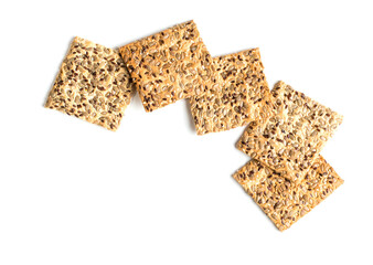 Square cookies with seeds on a white background