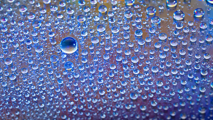 Water drops. Droplet texture. Abstract gradient background. Cold rainbow gradient. Heavily textured image. Shallow depth of field. Selective focus