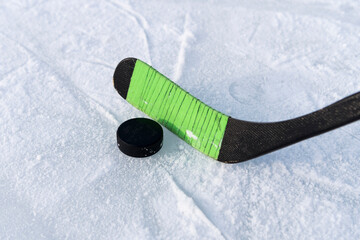 children's hockey stick rewound with electrical tape. hockey game. hitting the puck