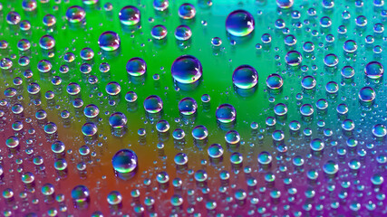 Water drops. Abstract gradient background. Droplet texture. Iridescent gradient. A highly textured image. Shallow depth of field. Selective focus