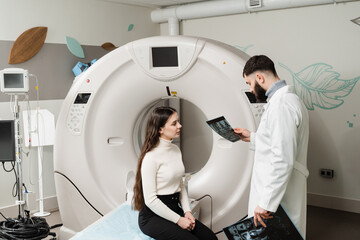 Consultation about spine CT scan for assess for herniated disk, tumors, extent of injuries, blood...