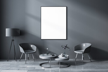 Front view on blank white poster in black frame on dark wall background in grey shades living room with vintage lamp and coffee table among glossy chairs on wooden floor. 3D rendering, mock up
