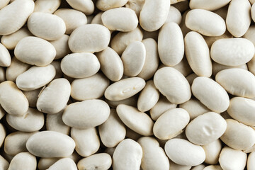 White beans texture background. Organic kidney beans pattern. Top view, close-up. Healthy food concept.