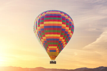 Landscape of fabulous Kapadokya. Colorful flying air balloon in sky at sunrise in Anatolia. Vacations in beautiful destination in Goreme, Turkey