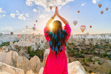 Boho girl traveler vacations beautiful destination in Goreme, Turkey. Fabulous Kapadokya with...