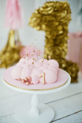 Pink cake with golden decorations