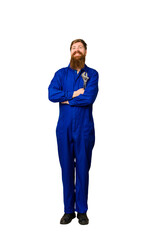 Adult mechanic man holding a wrench ful body cut out isolated