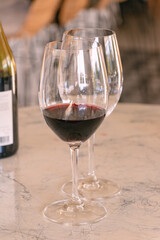 Red wine glass in a restaurant fine dining during sunset evening dinner