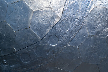 Modern background with metal hexagons and circles covered with scratches and roughness