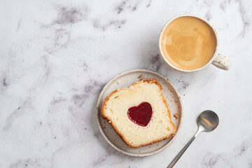 Valentine's day breakfast with heart-shaped cake and coffee
