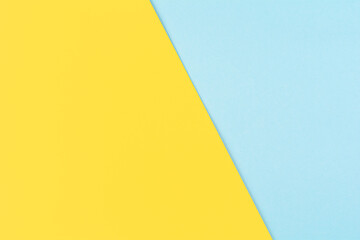 Yellow and pastel blue paper abstract background