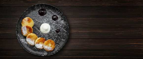 Cottage cheese cheesecakes, on a wooden background