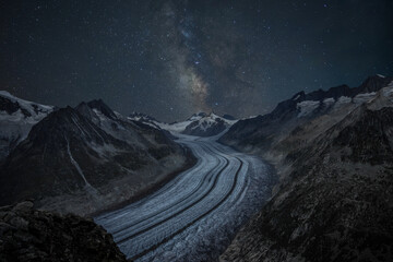 Mystical Nightscape of Aletsch Glacier in Valais, Switzerland, with Milky Way and Stars. Aletsch...