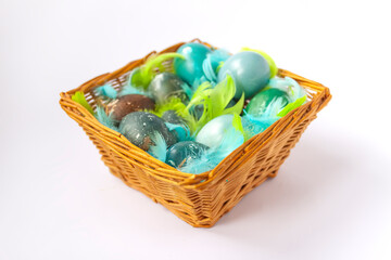 Colorful Easter eggs in a basket. Traditional festive decor.
