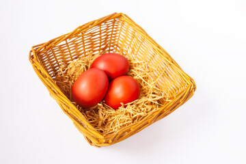 Fototapeta na wymiar Colorful Easter eggs in a basket. Traditional festive decor.