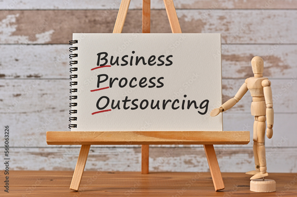 Poster there is notebook with the word business process outsourcing. it is an eye-catching image.