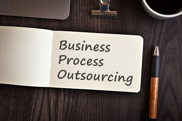 There is notebook with the word Business Process Outsourcing. It is an eye-catching image.