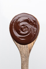 Hot chocolate in a wooden spoon. View from above.