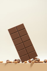 chocolate with nuts on a beige background