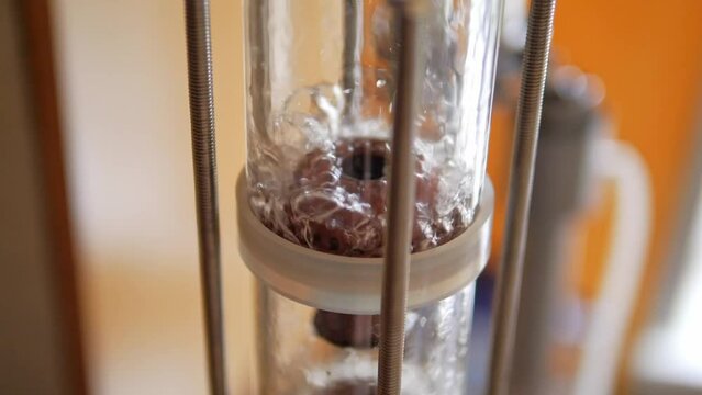 Bourbon distillation on a plate copper column close-up