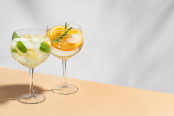 Mojito with lemon and orange on a gray background