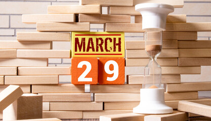 29 March in the calendar on a wooden background.