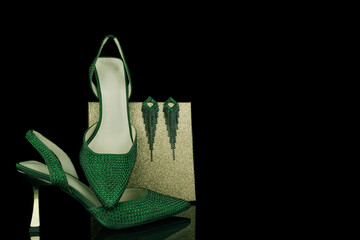 Beautiful green woman shoes with brilliant isolated  background