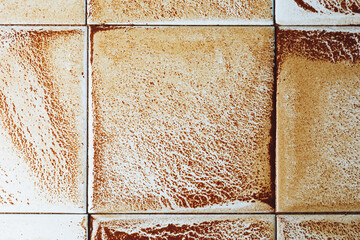 abstract wet rust scattering on a tile background