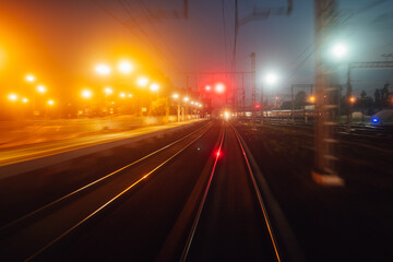 Fototapeta na wymiar fast moving on railway at night