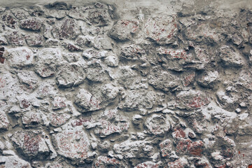 old stones wall with concrete background