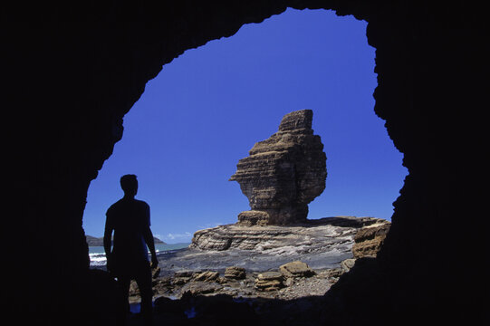 rock cave man silhouette