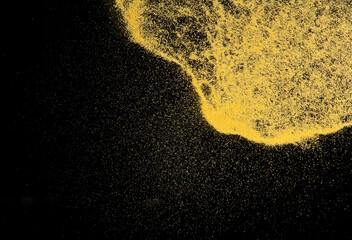 Small size yellow Sand flying explosion, gold cheese sands grain wave explode. Abstract cloud fly. Yellow colored sand splash throwing in Air. black background Isolated high speed shutter, throwing