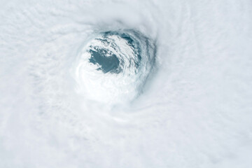 Hurricane from space, satellite view. Hurricane catastrophe. Elements of this image furnished by NASA. Selective focus. Noise and grain included.