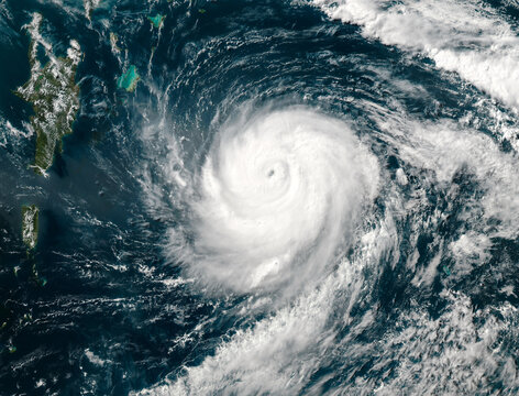 Hurricane from space, satellite view. Hurricane catastrophe. Elements of this image furnished by NASA. Selective focus. Noise and grain included.