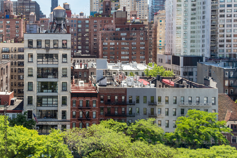 Wall mural Overhead view of historic buildings crowded in Midtown Manhattan New York City seen from the Roosevelt Island Tramway