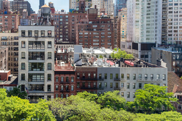 Overhead view of historic buildings crowded in Midtown Manhattan New York City seen from the Roosevelt Island Tramway - obrazy, fototapety, plakaty