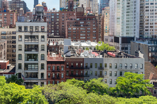 Fototapeta Overhead view of historic buildings crowded in Midtown Manhattan New York City seen from the Roosevelt Island Tramway