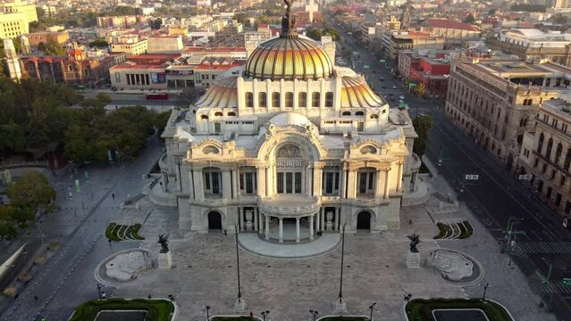 Experience the beauty of Mexico City from above at sunrise in this stunning drone footage. The video captures the impressive Torre Latinoamericana and the iconic Palacio de Bellas Artes, with warm col
