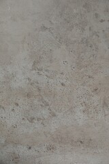 Texture of light grey stone surface as background, closeup