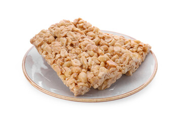Plate with tasty peanut bars (kozinaki) isolated on white