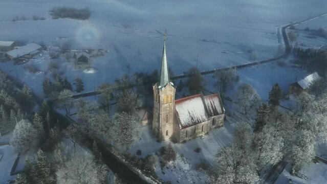 A rare weather phenomenon ringed glory behind the Church of Blessed Virgin Mary in Jõelähtme, Estonia.