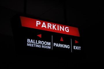 Illuminated parking sign at a hotel