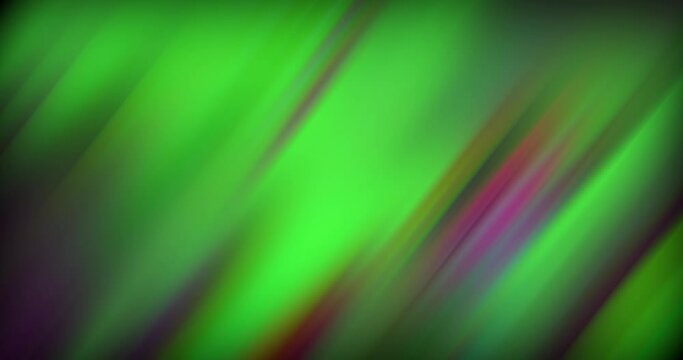 Defocused and abstract flashing neon pink green magenta purple diagonal light streaks motion on dark black abstract background for screen project overlay.