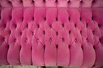 Fototapeta premium bright pink velvet sofa texture with button tufts