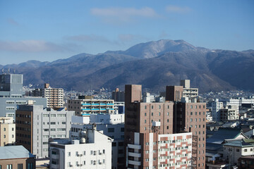 ドローンで空撮した冬の長野県松本市の街風景
