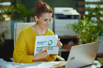 business owner woman having video conference and showing charts